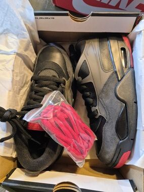 Air Jordan Size. 6.5 Kids Black and Red Low-Top Sneakers with Extra Red Laces